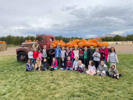 Mrs. McMullin's Class in front of the pumpkin truck at Rowley's Red Barn