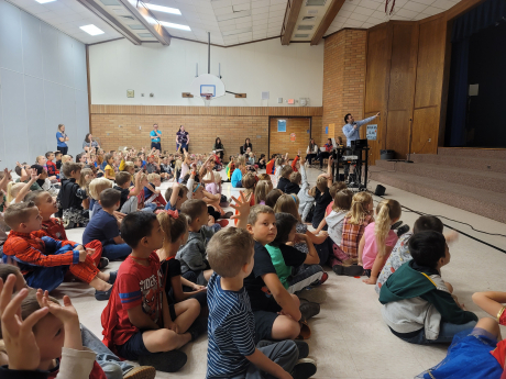 1st and 2nd grade students enjoy the assembly