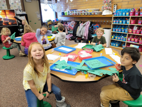Students smile while working on Christmas Projects