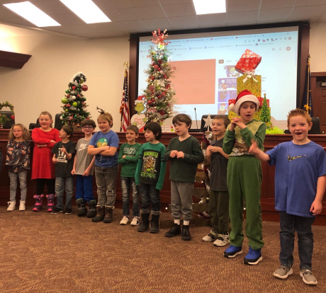 Students singing at the District Office