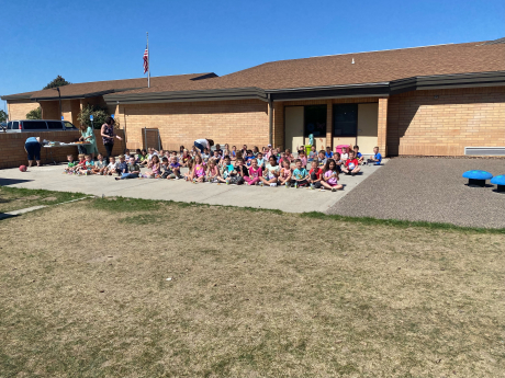 Kindergarteners smile with popsicles 