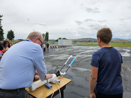 Mr. Griffith gets ready to launch a student's rocket