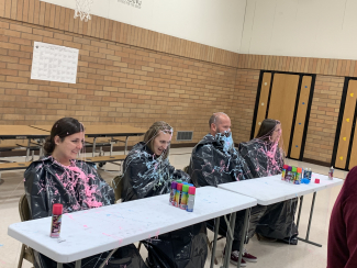 Mrs. Peterson, Miss Williamson, Mr. Richins, and Mrs. Snelgrove covered in silly string