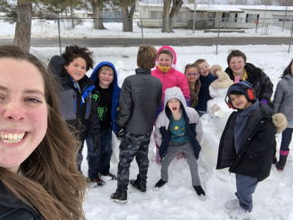 Miss North's class poses for a picture with the snowman they built