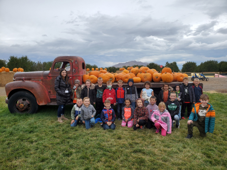 Mrs. Barnum's class in front of the pumpkin truck at Rowley's Red Barn