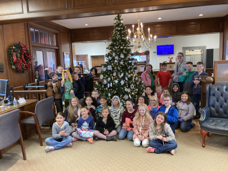 3rd Grade students in front of the tree they made ornaments for at Zion's Bank
