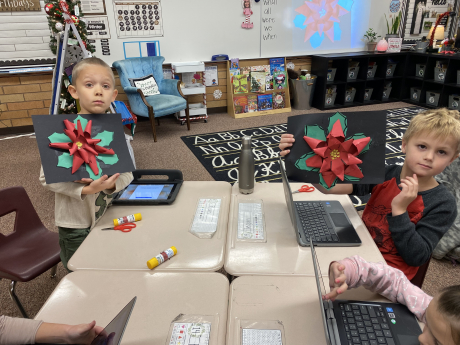 Students in Mrs. McMullin's Class with their poinsettias