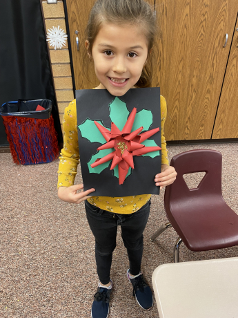 A student shows off her art work