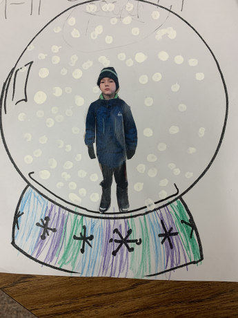 1st Grade boy inside a snowglobe