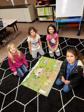 Students with their completed puzzle