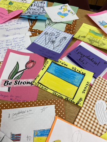 A table full of cards that students have created in art class