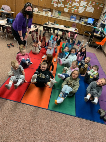 Miss Dooley's class showing their socks for Fox in Socks Day