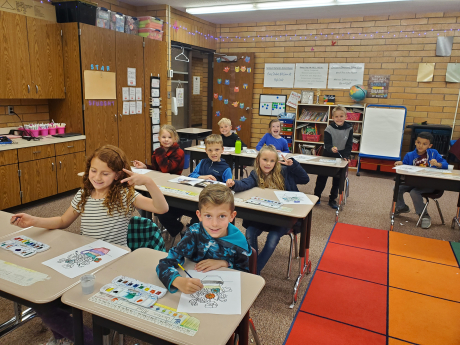 Mrs. Ostler's Students watercoloring at their desks