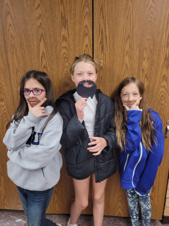 5th grade girls show off their beards