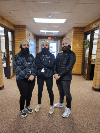 Mrs. Barnum, Mrs. McMullin, and Mrs. Junior in bald caps and beards