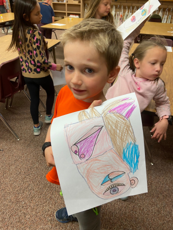 A student shows his picasso artwork