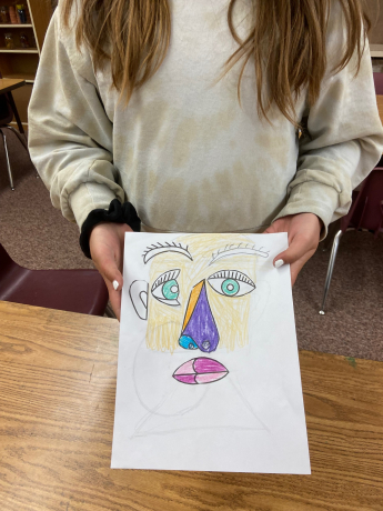 a student shows their picture