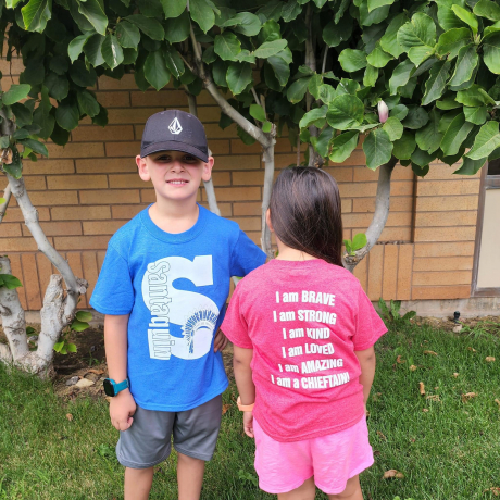 Students modeling the school t shirt. 