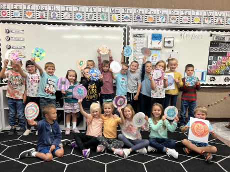 1st graders showing off their dots