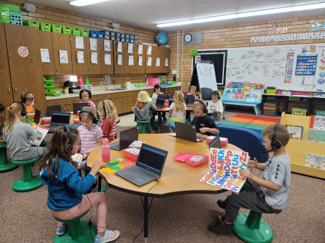Students read along with chromebooks