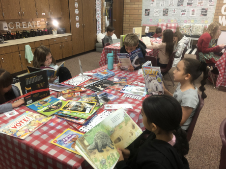 Students reading at a decorated table