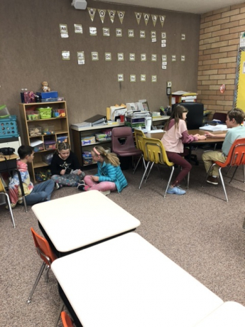 Students around the room reading with their buddies