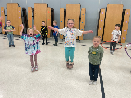 Kindergarten students hula hooping
