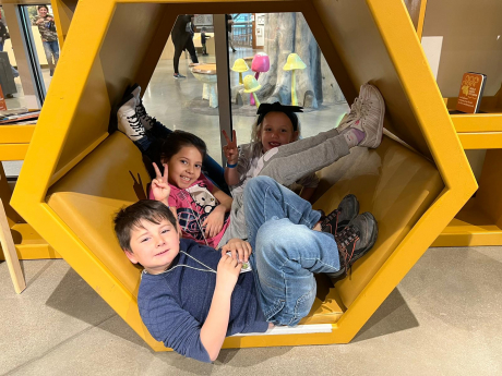 Students pose in the play area