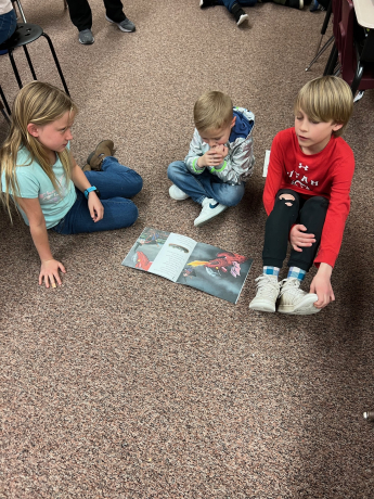 Students read together on the floor