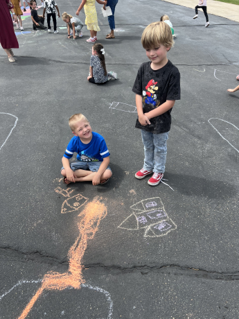 boys using chalk together